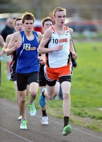 Jacob Aune of Cedar Rapids Prairie did well in the Washington Relays on Monday in Washington, Iowa. He wore one blue shoe and one green shoe. (Photo by Ken Gilchrist)